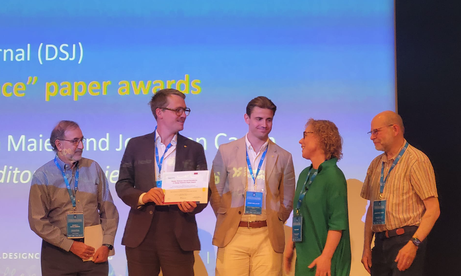 Per receiving the Best Paper Award on stage at DESIGN 2026